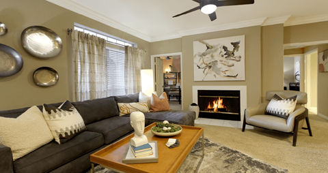 a living room with a couch and a fireplace